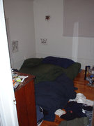 where i sleep. only slightly less messy than the livingroom.