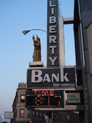 multifunction sign at liberty bank for time