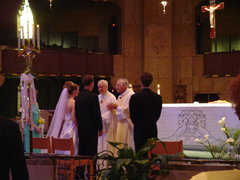 father prus blessing the couple