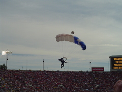 secondary military crossover. usaf parachutists bringing in the game ball.