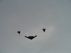 an f-117a, a b-2 and an f-22 overfly the route