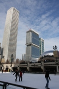 the aon center nee standard oil building and cloud gate behind the millenium park icerink