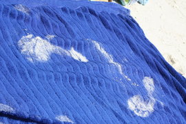 the sound of sandy footprints on the beach towels