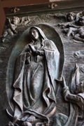 detail of mary on one of the side doors