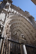 a door of the massive cathedral in toledo