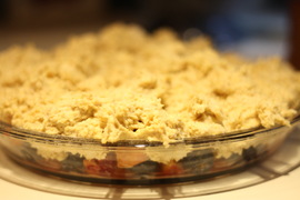 peach berry cobbler with a cornmeal buttermilk biscuit topping