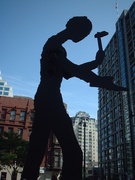 the back side of the hammering man